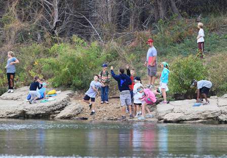 The gang was having a great time, laughing, talking and chunking rocks into the water.