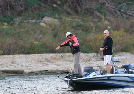 Johnson quickly hooks up with a bass, but like many others that have been caught this week, it was too short.