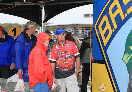 Elite Series pro Clark Reehm stands to the side of the stage, hoping his goal of making the Bassmaster Classic would be realized. It was as he took home second in points for the Central Opens for 2010.