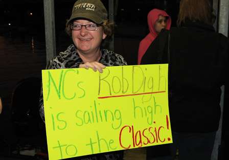 Fans hold signs in support of Rob Digh of North Carolina.