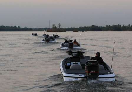 A line of competitors idle out past the no wake zone before taking off to their first spots of the day.