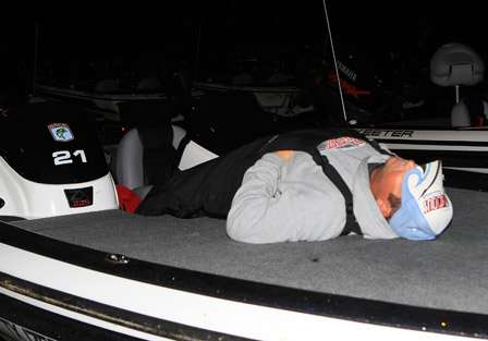 Brian Maloney grabs three winks as he waits to be towed to the ramp, it has been a tiring three days on everyone.