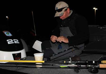 Paul Hemsley ties on a jig in preparation for the final day.