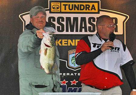 Galen James holds up his 7.22-pound big bass of the day, part of his second-place stringer weighing 21.11 pounds.