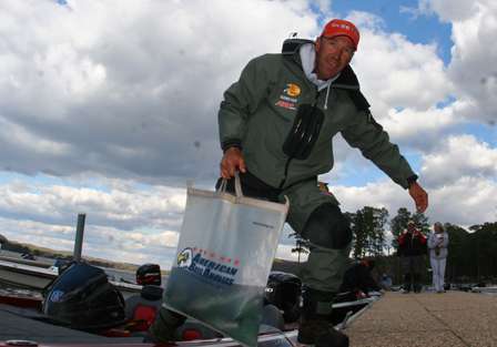 Anglers grab their weigh-in bags and walk down the docks at the Lake Guntersville State Park.