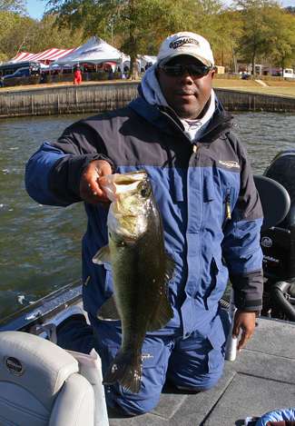 Non-boater Kenny Bivins holds up this 5.15-pound largemouth he caught on the third day of competition.