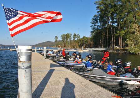 The American flag flies over the dock as anglers wait for the weigh-in to begin.