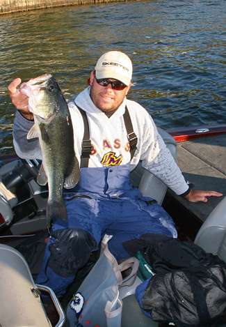 Clent Davis holds up the biggest largemouth he caught on Day Four on Lake Guntersville.