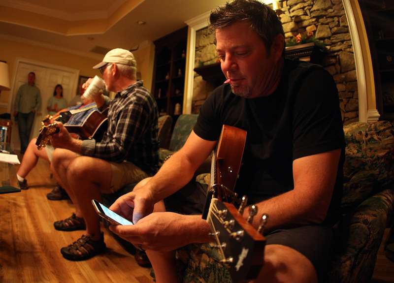 Clawson looks through his phone to find the words to the first song he would sing. Clawson was named the 2013 BMI Songwriter of the Year. 
