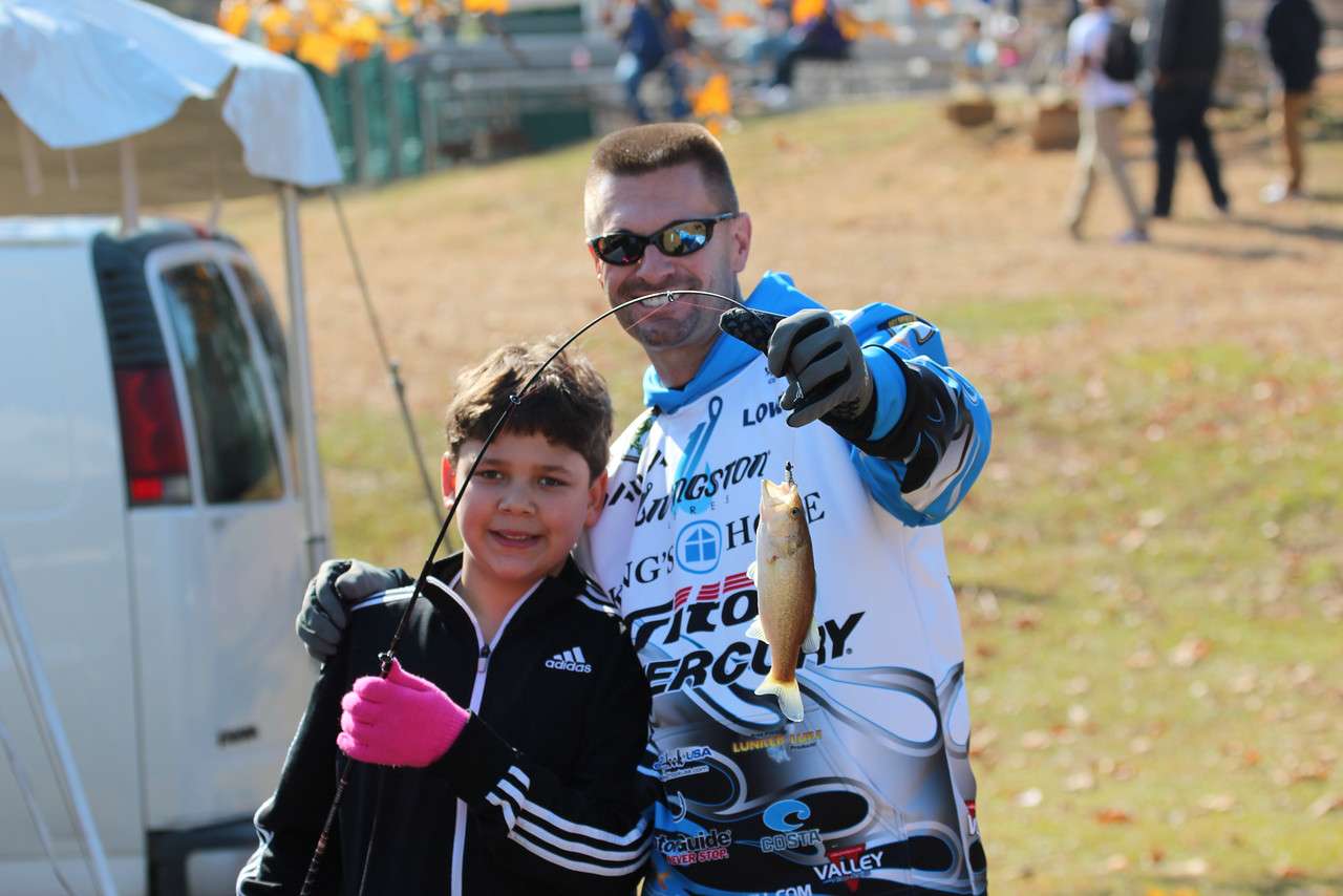 For this kid the fish may not be huge, but the opportunity to fish and get a photo with the Classic champion is.