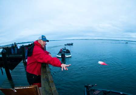 The floats get tossed to the anglers as they idle through morning inspection.