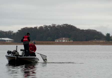 Swindle's non-boater scoops the fish into the net and another bass is in the boat for the tournament leader.