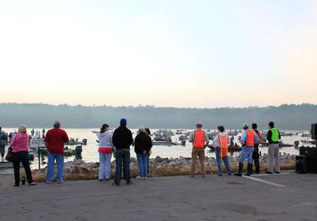 Fans and volunteers watch from the edge of the parking lot as the 5:45 a.m. (CT) launch time draws near.