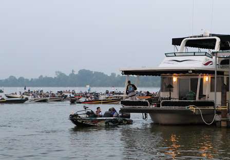 The BASS staff turns a house boat into an inspection platform as they make their way through the first launch of the Bassmaster Central Open #2 presented by Bass Pro Shops.