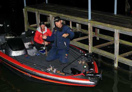 James Biggs preps gear as his Day One co-angler, Steven Mitchell, watches.