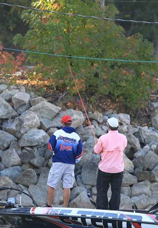 Chad Brauer gives a hand to his co-angler, Patrick Ross, who was fishing about 12 feet higher than Brauer.