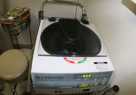 The centrifuge machine spins for 12 minutes and separates the red blood cells from the plasma component. 