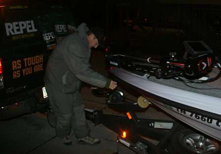 Gary Klein unlatches the front of his boat early in the morning on the first day of official practice for the 2011 Bassmaster Classic.