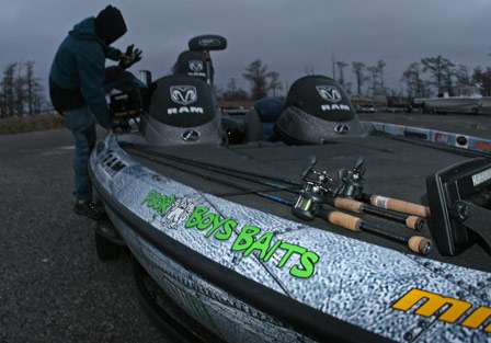 Ryan Said jumps into his boat after getting his rods ready for practice on the Louisiana Delta.