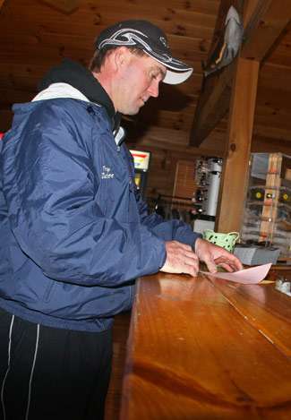 Terry Butcher stops by the desk to get a launch permit on the first day of Classic practice.