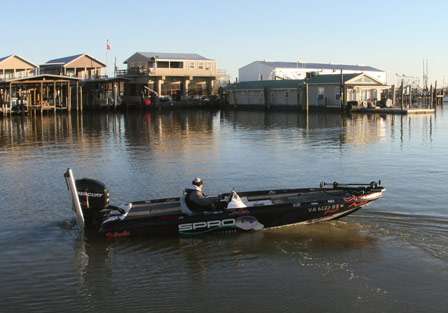 Crews idles away from the docks in the Venice Marina before beginning the second day of practice.