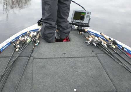 The front deck was covered with rods as Pace frequently changed lures to locate active bass.