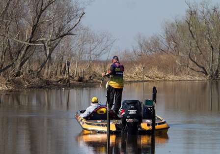 A small fish gets swung into the boat as Randall Tharp looks to fill out his five-fish limit.