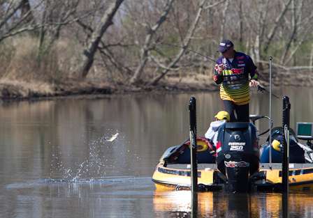 Tharp swings a small fish into the boat Friday.
