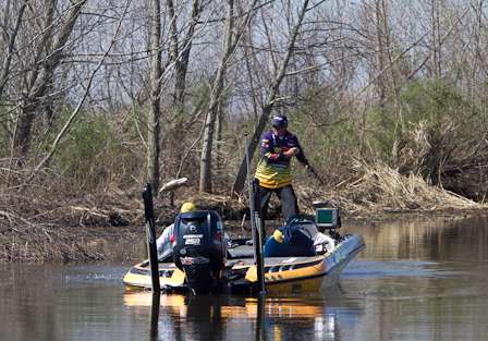 Tharp flings another keeper-sized Delta largemouth into his boat on Day One.