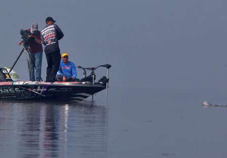 Day One leader Aaron Martens pulls in a small bass early on Saturday.