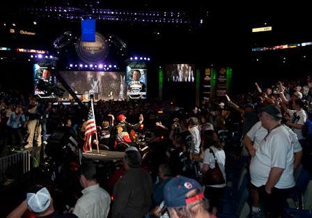 Fans look on to the VanDams' victory lap.