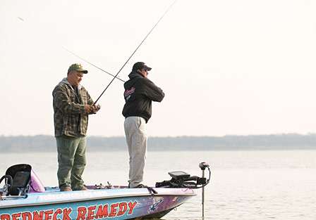 Billy McCaghren and Frank Delgado fish from the front of the boat.

