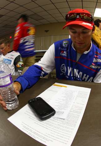Elite Series rookie Brandon Palaniuk checks over the notes provided for the anglers briefing. 
