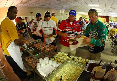 Elite Series anglers and their Marshals line up for barbecue after being paired up for Day One of the Bassmaster Elite Series event on Florida's Harris Chain of Lakes. 