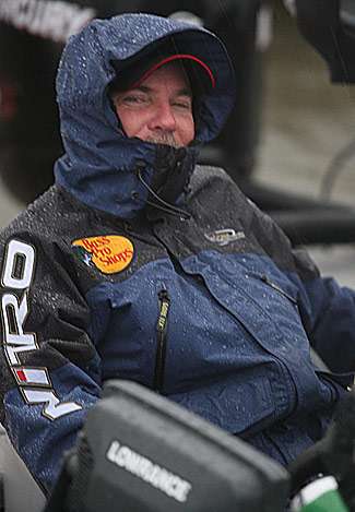 Dennis Tietje shows a rain-soaked grin.