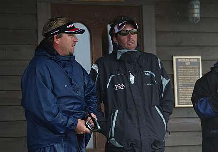 J. Todd Tucker and Travis Manson discussing the weather on the porch of a coffee house.