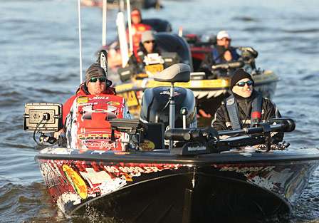 Jason Williamson is followed by Mike Iaconelli and other anglers as he idles through the no-wake zone.