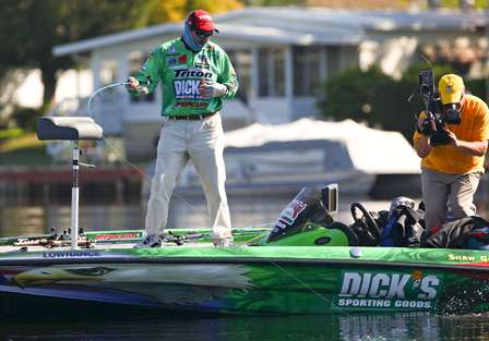 Grigsby hooks another fish while Rick Mason captures the action for Bassmaster television. 