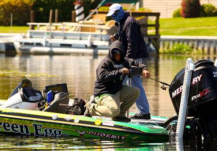J. Todd Tucker has a good fish hooked and moves to the back of the boat to finish the fight. 