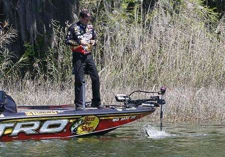 VanDam wastes little time skittering a bass to the boat. Most of his catch hit shallow crankbaits.