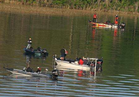 A wad of spectators watch Kevin VanDam at his first spot Sunday morning.