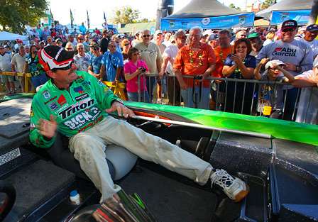 Shaw Grigsby has fun with the crowd before weighing his fish. 