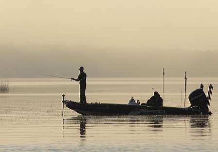 John Crews can be seen fishing as a fog lifts.