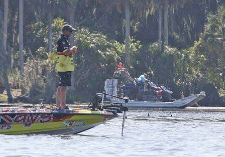 Jeff Kriet is passed by locals in an airboat just before hooking up.