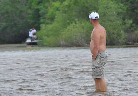 Spectator boats were kept out of the small creek by a shallow bar. This fishing fan waded across the flat for a better view of the action. 