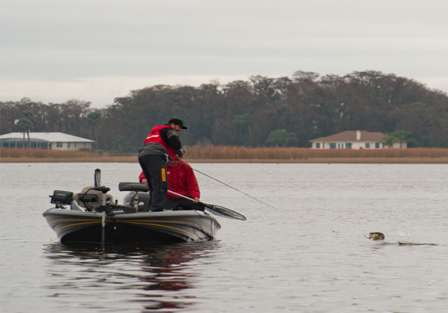 Swindle hooks up with a nice keeper bass and battles it toward the boat.