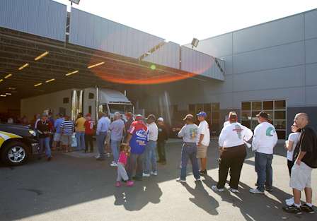 Anglers and co-anglers line up for registration outside the Michael Waltrip Racing headquarters.
