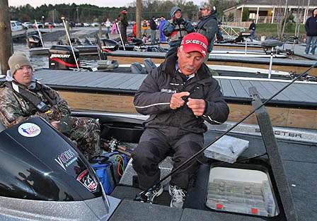 Pro Dave Mansue does some last-minute work on his lures.