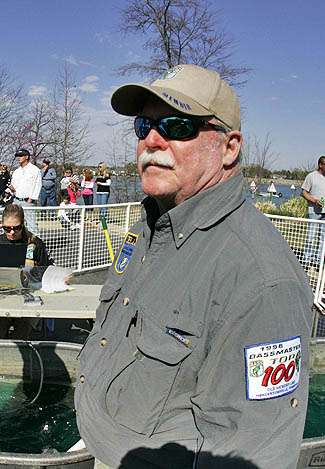 Larry Sifert of Scottsdale, Ariz., proudly wears his B.A.S.S. patched shirt while waiting at the tanks.