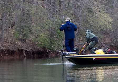 Card's co-angler Ethan Cox readies the net.